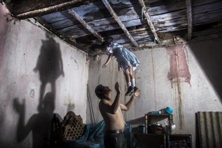 Self-portrait with my daughter and the presence of a hanging man. Taxco, Guerrero, Mexico. 2013. © Yael Martínez